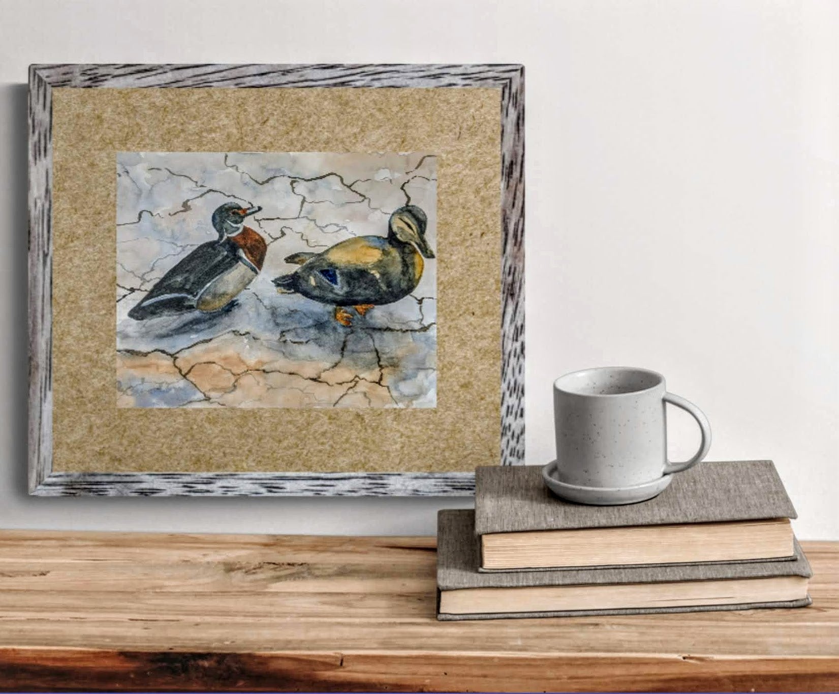 Ducks at a Picnic watercolor painting above the bookshelf